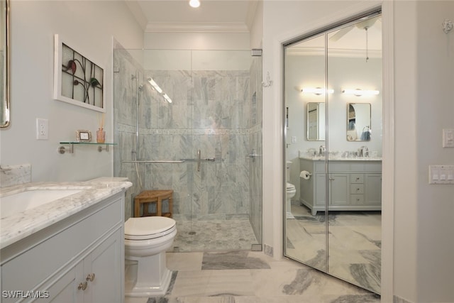 bathroom featuring ornamental molding, tiled shower, vanity, and toilet