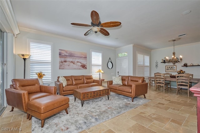 living room with ceiling fan with notable chandelier, crown molding, and a wealth of natural light