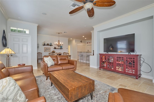 living room with ceiling fan with notable chandelier and crown molding