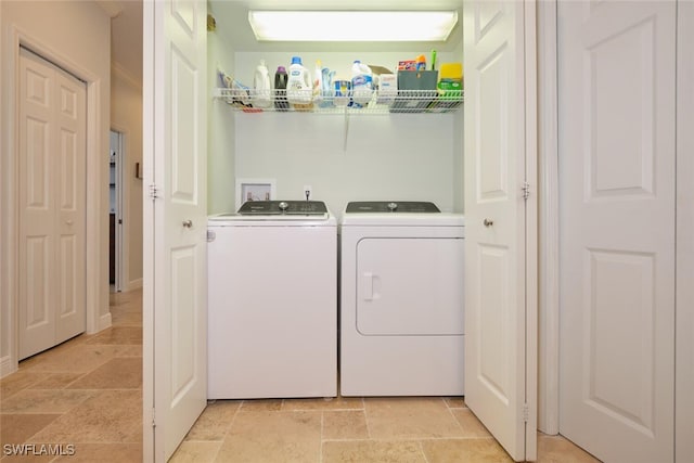 washroom with separate washer and dryer