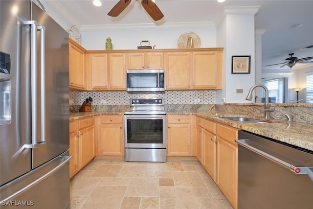 kitchen featuring light stone countertops, ornamental molding, sink, and stainless steel appliances