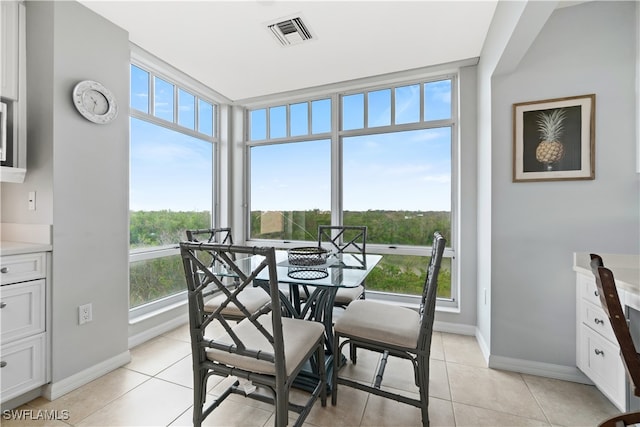 tiled dining room featuring a wealth of natural light