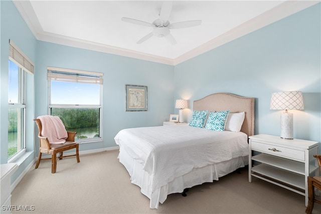 carpeted bedroom with ceiling fan, multiple windows, and ornamental molding