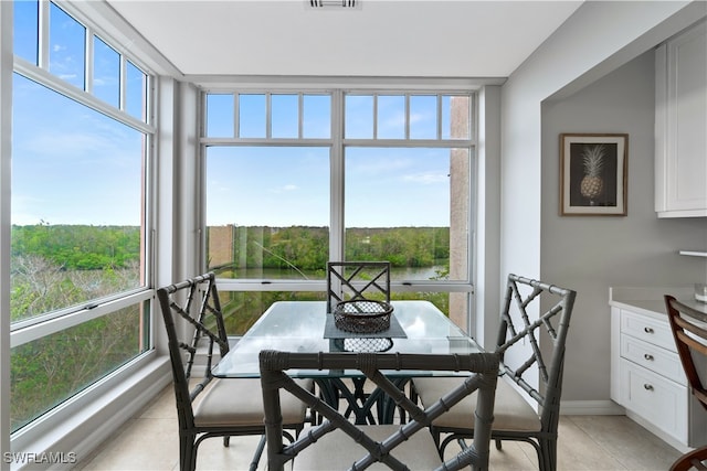 sunroom / solarium featuring a wealth of natural light