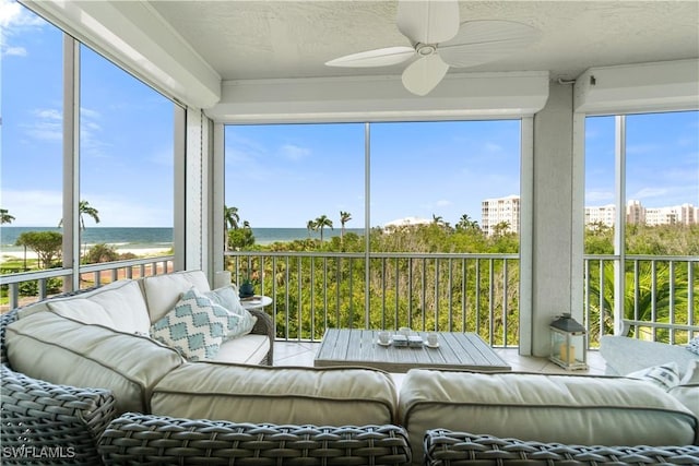 260 Barefoot Beach Blvd Unit 301, Bonita Springs, FL 34134 - sunroom / solarium with a water view, plenty of natural light, a textured ceiling, and tile patterned flooring