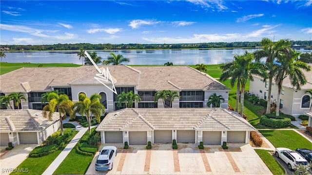 birds eye view of property with a water view