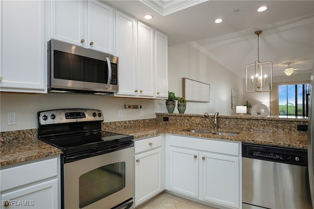 kitchen with white cabinets, ornamental molding, sink, and appliances with stainless steel finishes