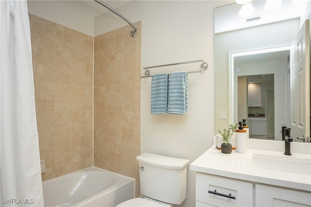 full bathroom featuring shower / bath combo, vanity, and toilet