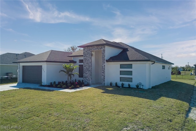 view of front facade featuring a garage and a front yard