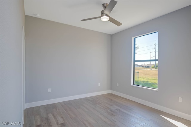 spare room featuring ceiling fan and light hardwood / wood-style floors