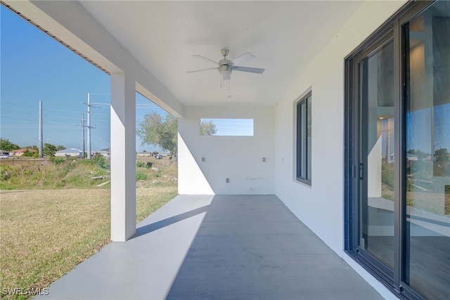 view of patio featuring ceiling fan