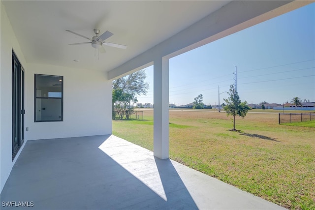 view of patio / terrace featuring a rural view and ceiling fan