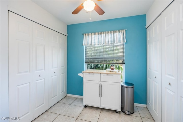 bathroom featuring tile patterned floors and ceiling fan