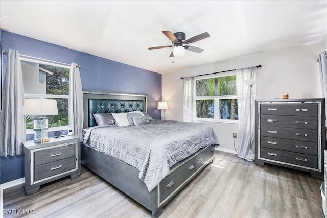 bedroom featuring light hardwood / wood-style flooring and ceiling fan