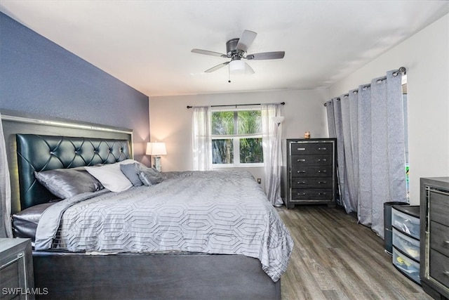 bedroom with wood-type flooring and ceiling fan