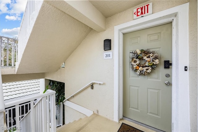 property entrance with a balcony