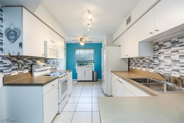 kitchen featuring sink, white cabinets, decorative backsplash, and white appliances