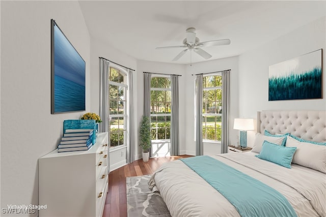 bedroom featuring wood-type flooring and ceiling fan