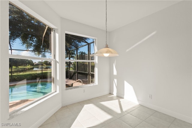 unfurnished dining area featuring light tile patterned floors