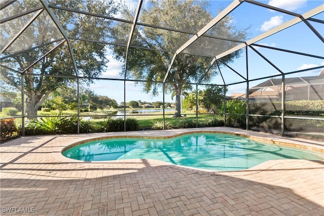 view of swimming pool with a patio and a lanai