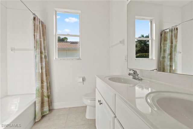 full bathroom with tile patterned floors, shower / bath combination with curtain, vanity, and toilet