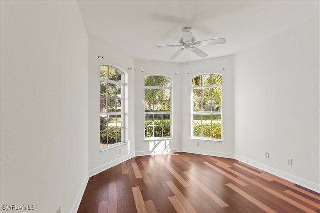 unfurnished room with hardwood / wood-style flooring and ceiling fan