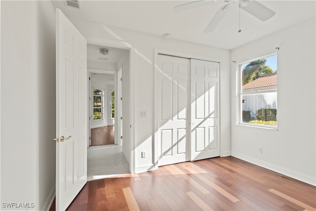 spare room featuring ceiling fan and wood-type flooring