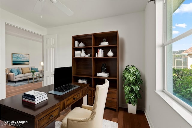 office featuring ceiling fan, plenty of natural light, and wood-type flooring