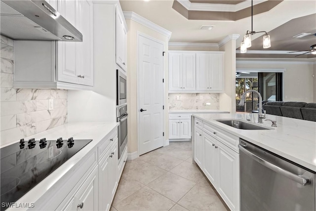 kitchen with sink, white cabinets, and appliances with stainless steel finishes