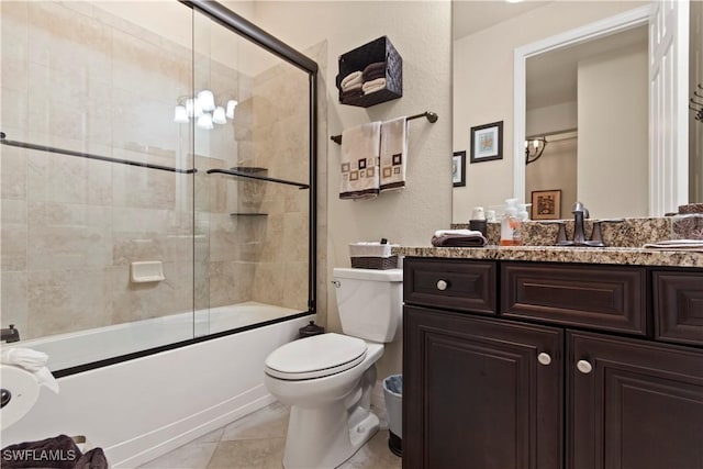 full bathroom featuring enclosed tub / shower combo, toilet, tile patterned floors, and vanity