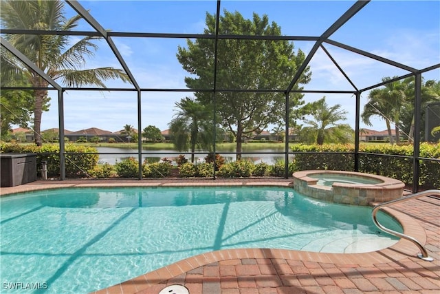 view of pool with a lanai, a patio area, an in ground hot tub, and a water view