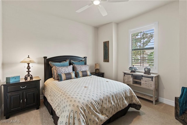 bedroom featuring light carpet and ceiling fan