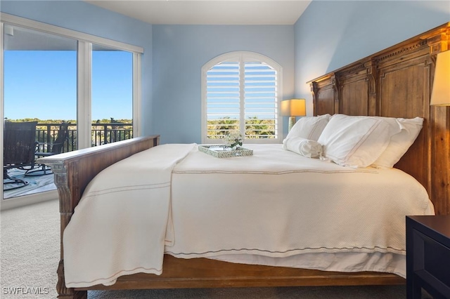 bedroom featuring carpet and access to outside