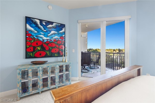 bedroom featuring carpet flooring and access to outside