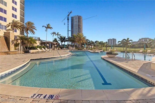 view of swimming pool with a patio area