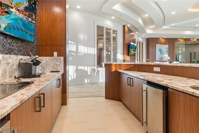 kitchen featuring light stone countertops, black electric stovetop, backsplash, wine cooler, and light tile patterned flooring