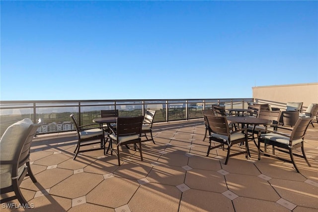 view of patio featuring a balcony