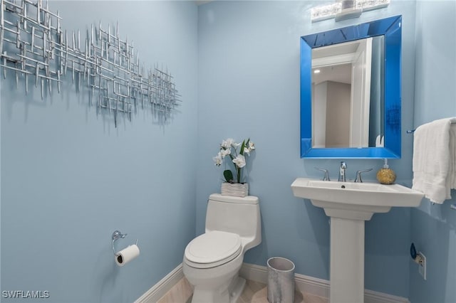 bathroom with sink and toilet