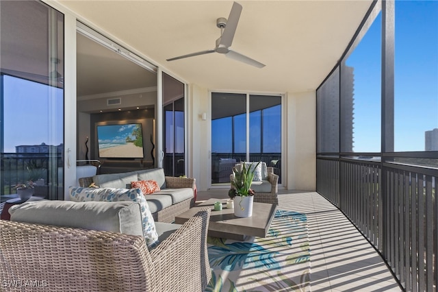 sunroom / solarium with ceiling fan