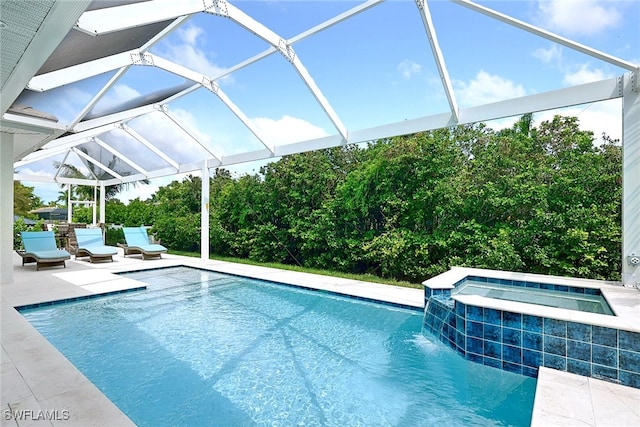 view of pool featuring a lanai, a patio, an in ground hot tub, and pool water feature