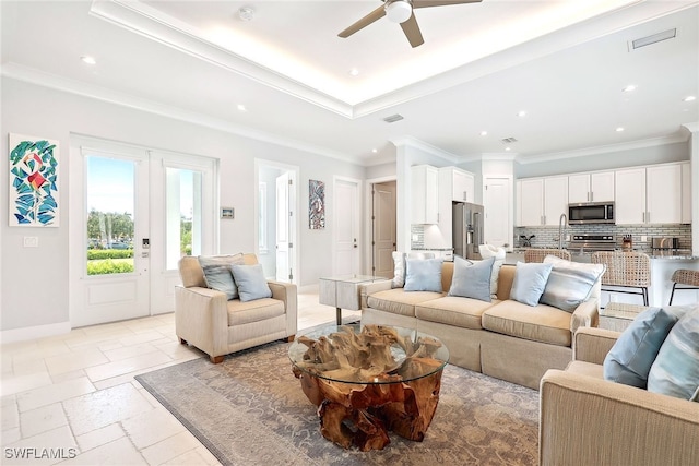 living room featuring ornamental molding and ceiling fan