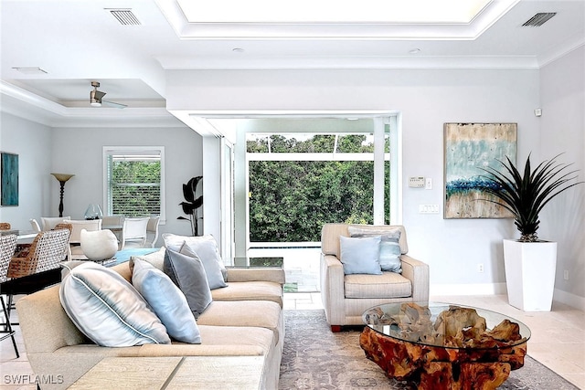 living room featuring ceiling fan and crown molding