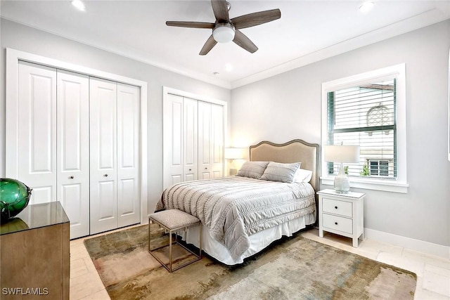 101 Bald Eagle Dr, Marco Island, FL 34145 - bedroom with multiple closets, baseboards, recessed lighting, ornamental molding, and a ceiling fan