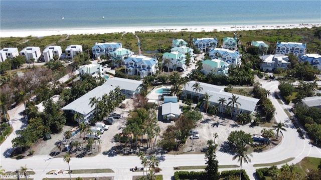 aerial view featuring a water view and a view of the beach