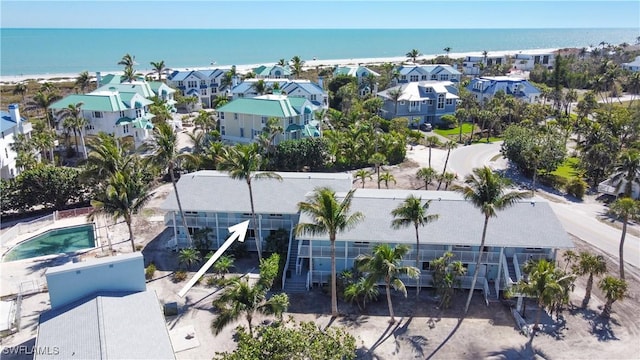 bird's eye view with a residential view and a water view