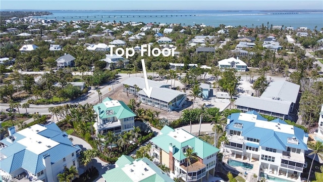 aerial view with a water view and a residential view