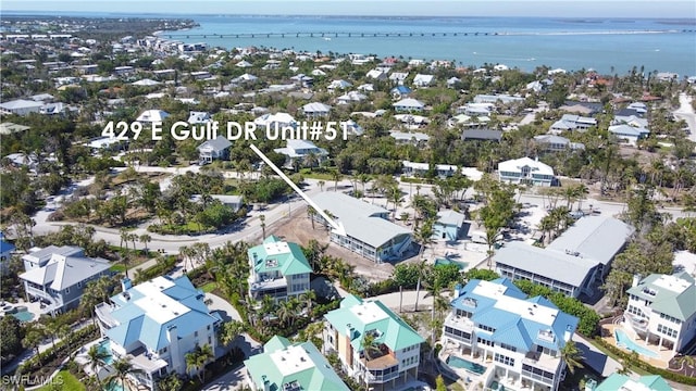 birds eye view of property featuring a water view and a residential view