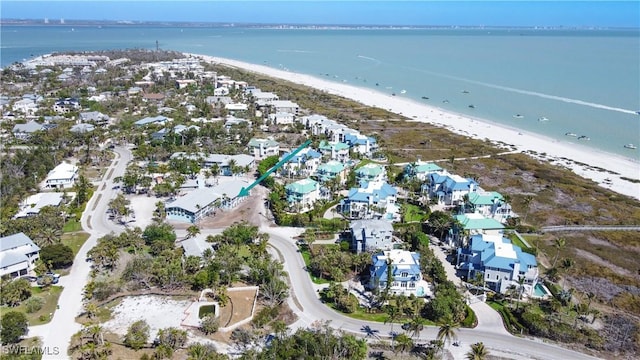 bird's eye view featuring a residential view, a beach view, and a water view