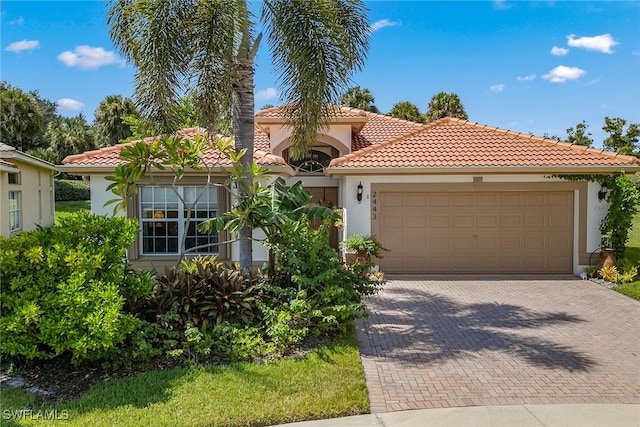 mediterranean / spanish-style home featuring a garage