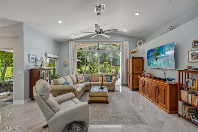 living room featuring ceiling fan and lofted ceiling